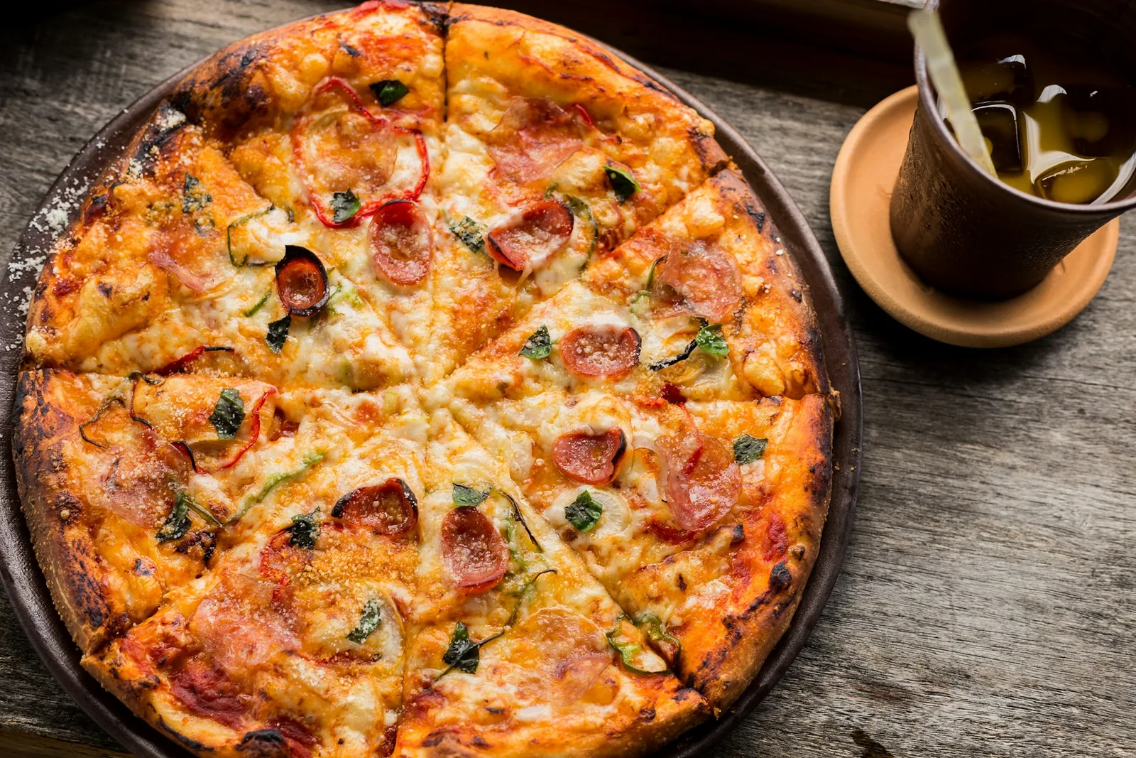 A pizza on a rustic surface