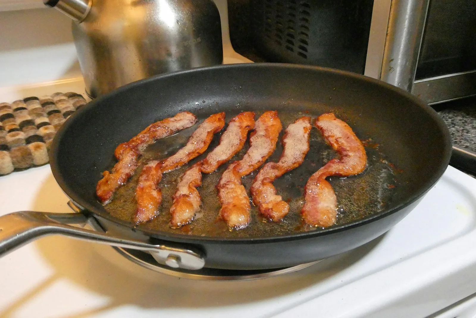 Bacon cooking in a pan