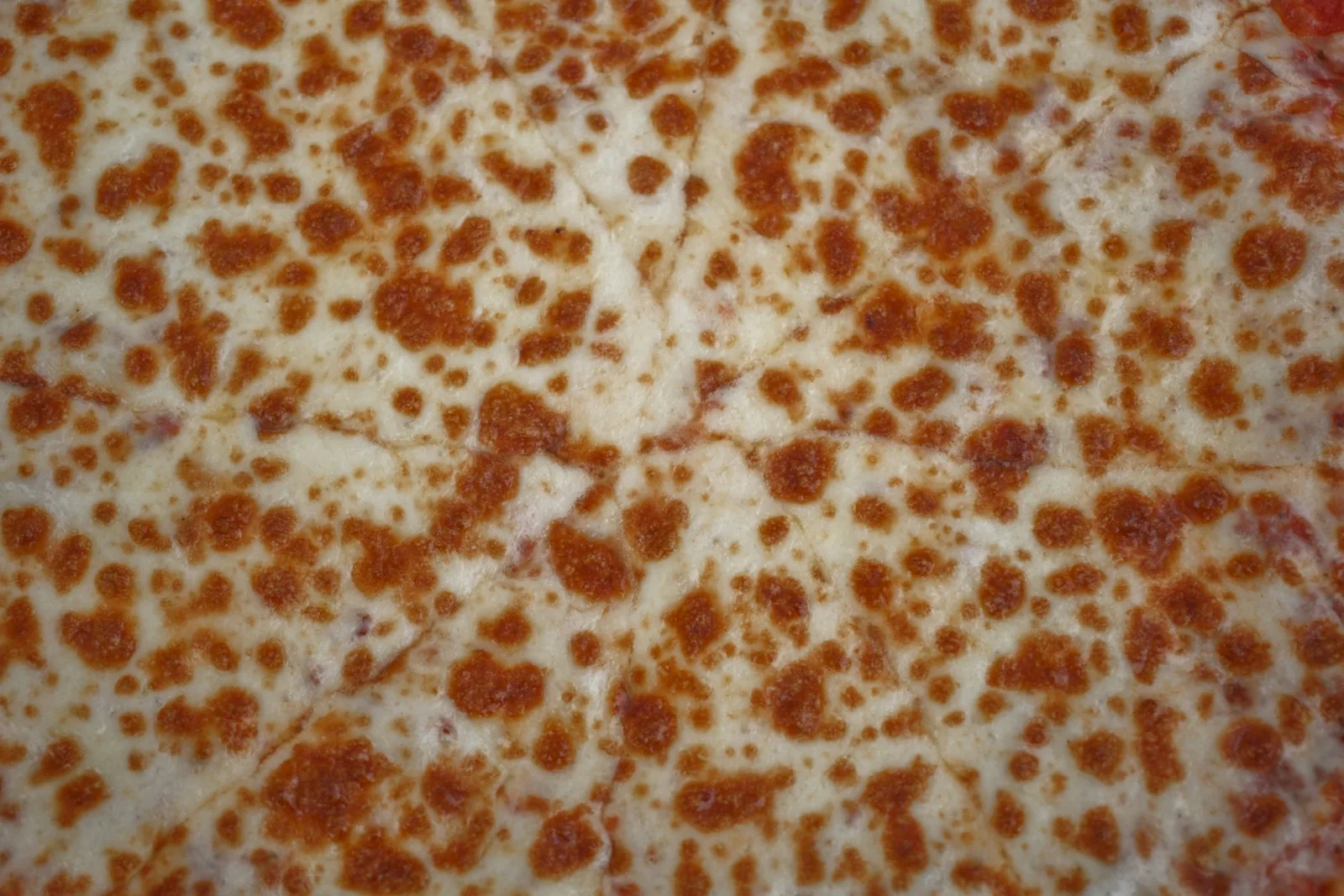 Melted cheese on a pizza