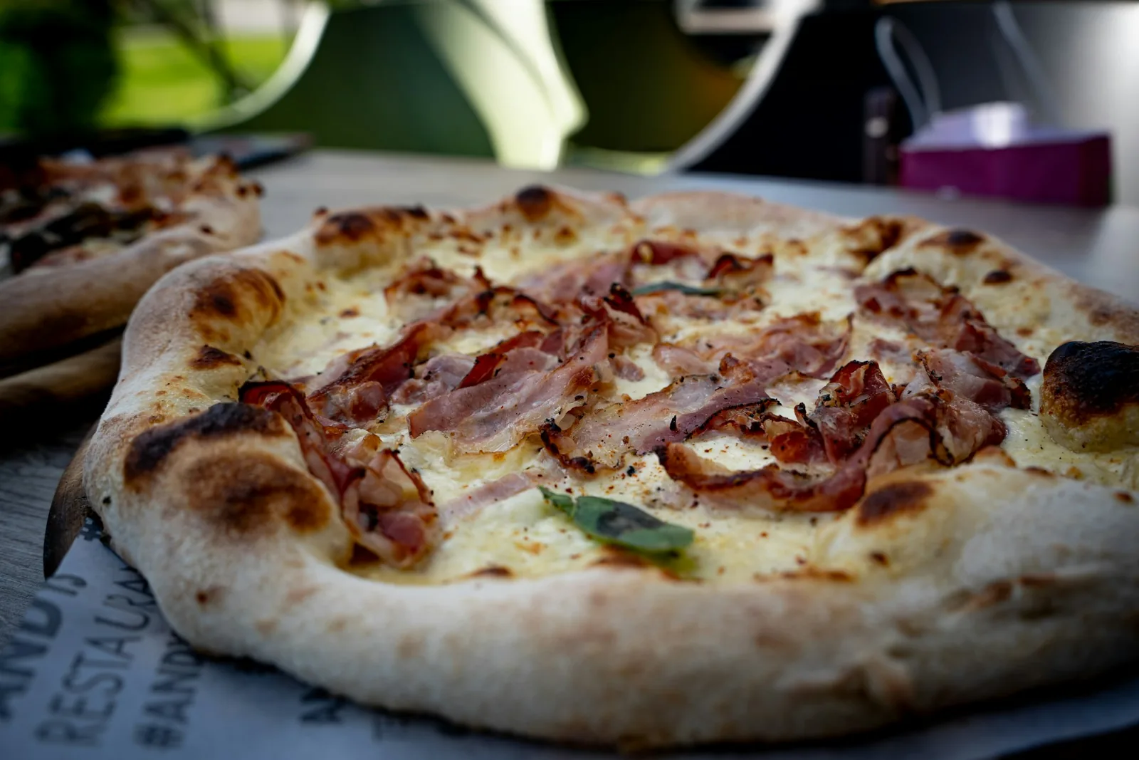 A pizza in warm light