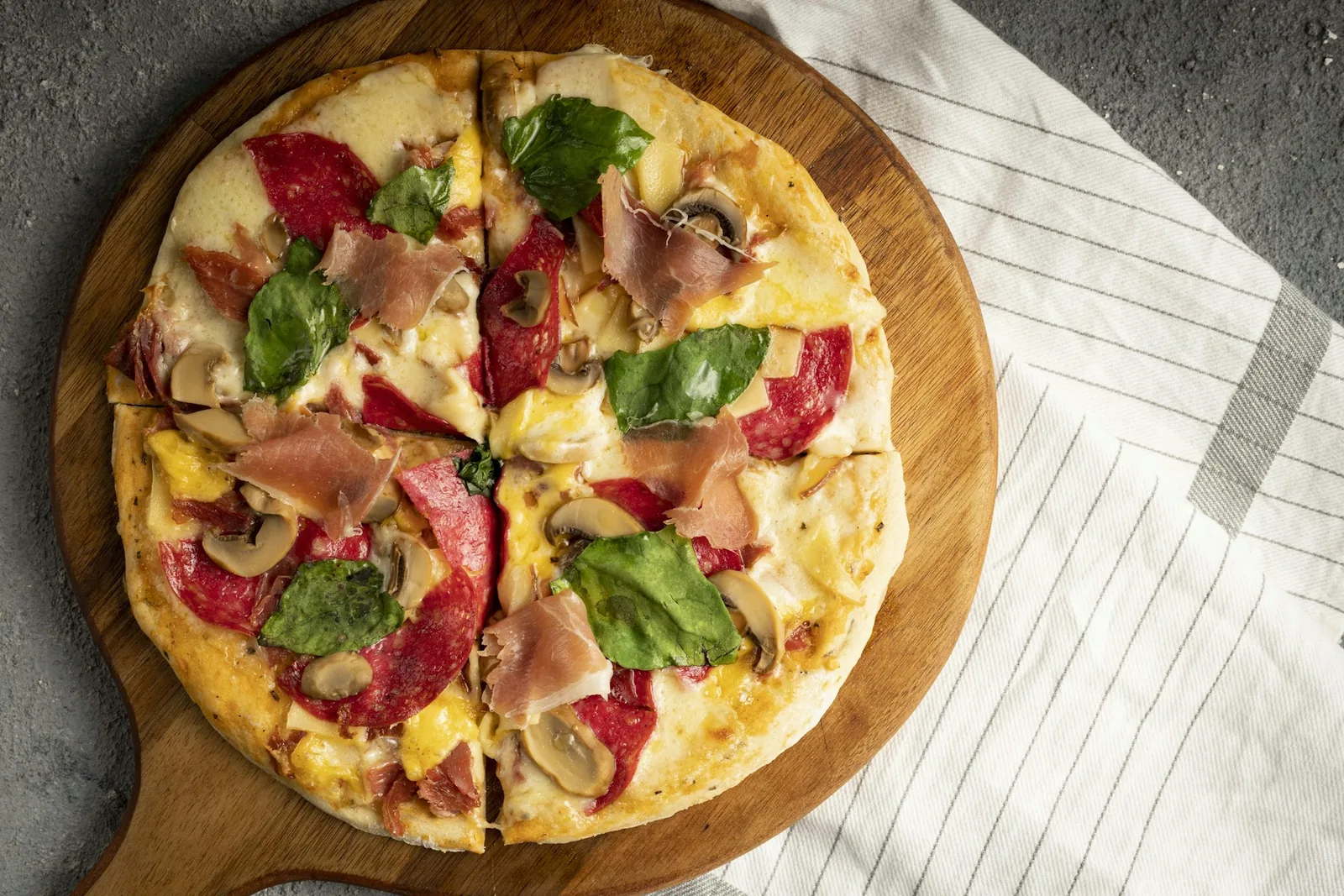 A pizza topped with bacon