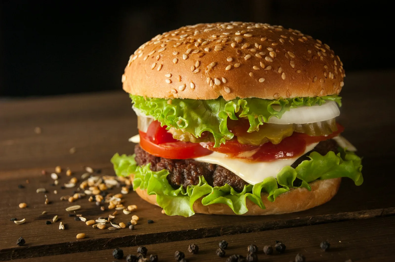 A burger with lettuce and tomato