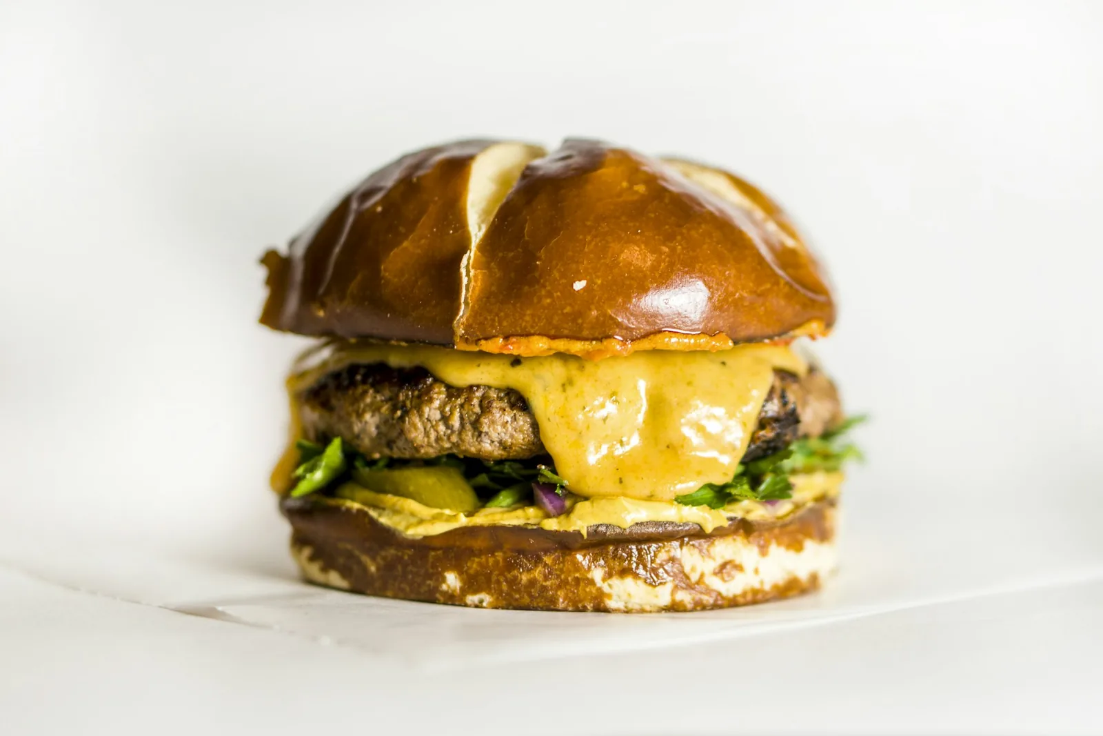 A cheeseburger on a roll