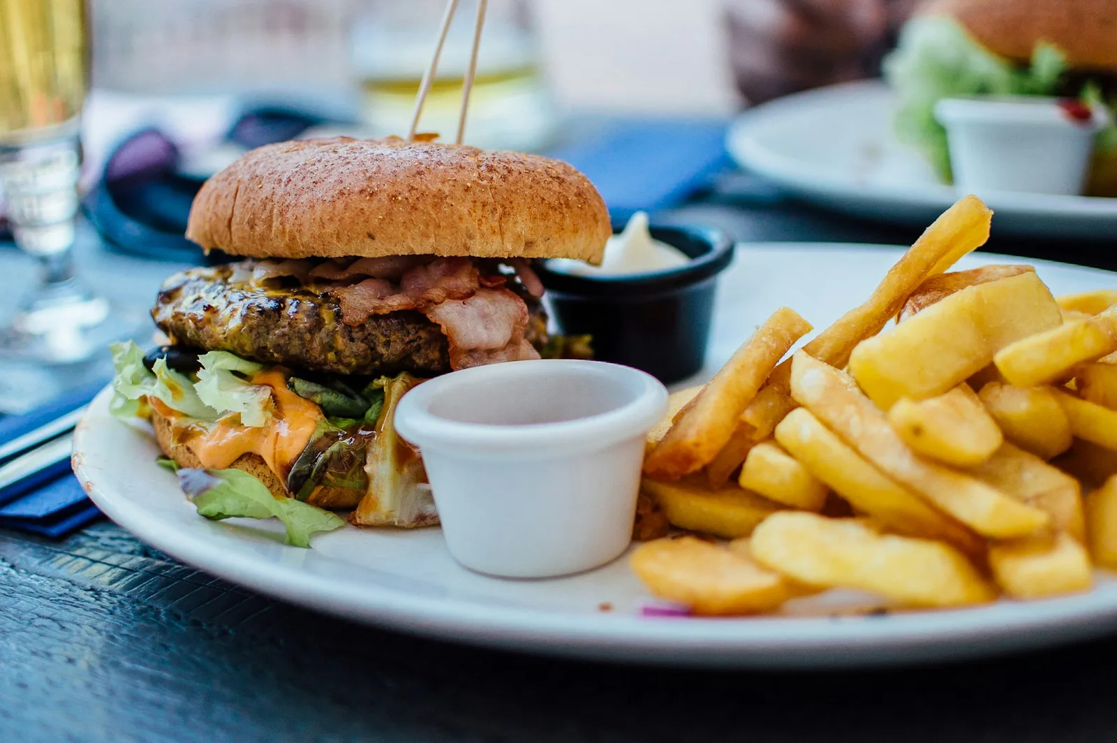 A burger served with fries