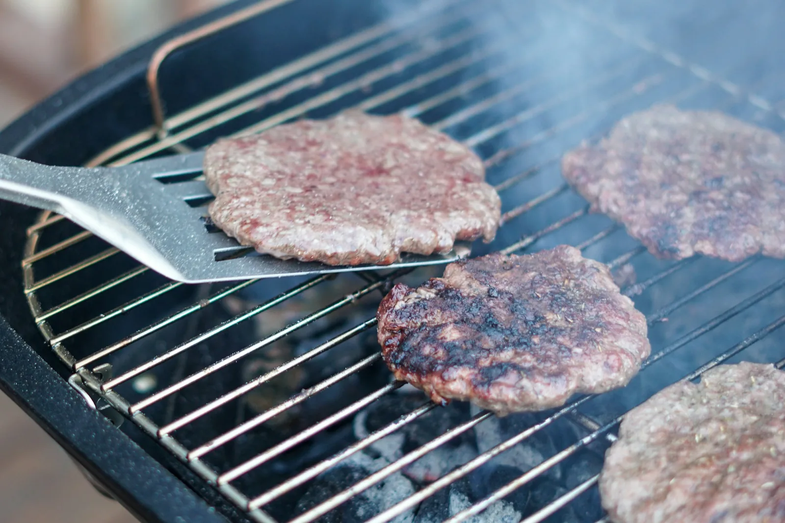 A burger patty on a griddle