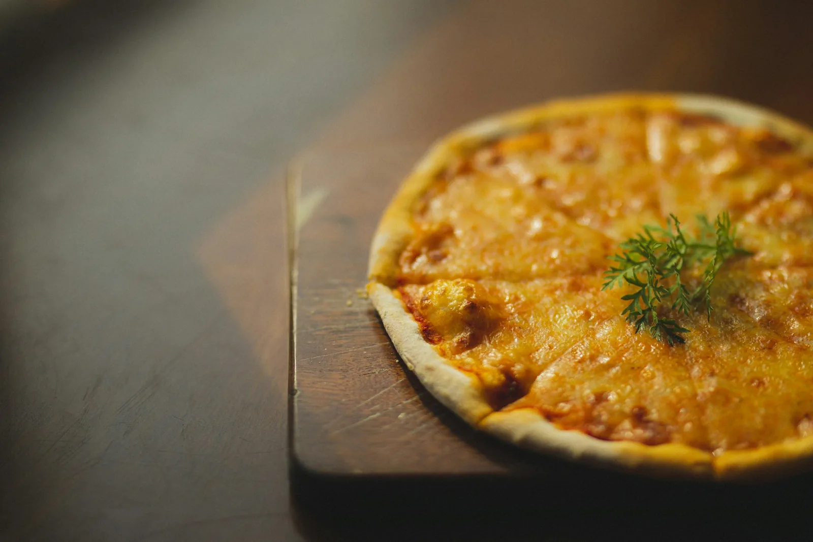 A pizza in warm light