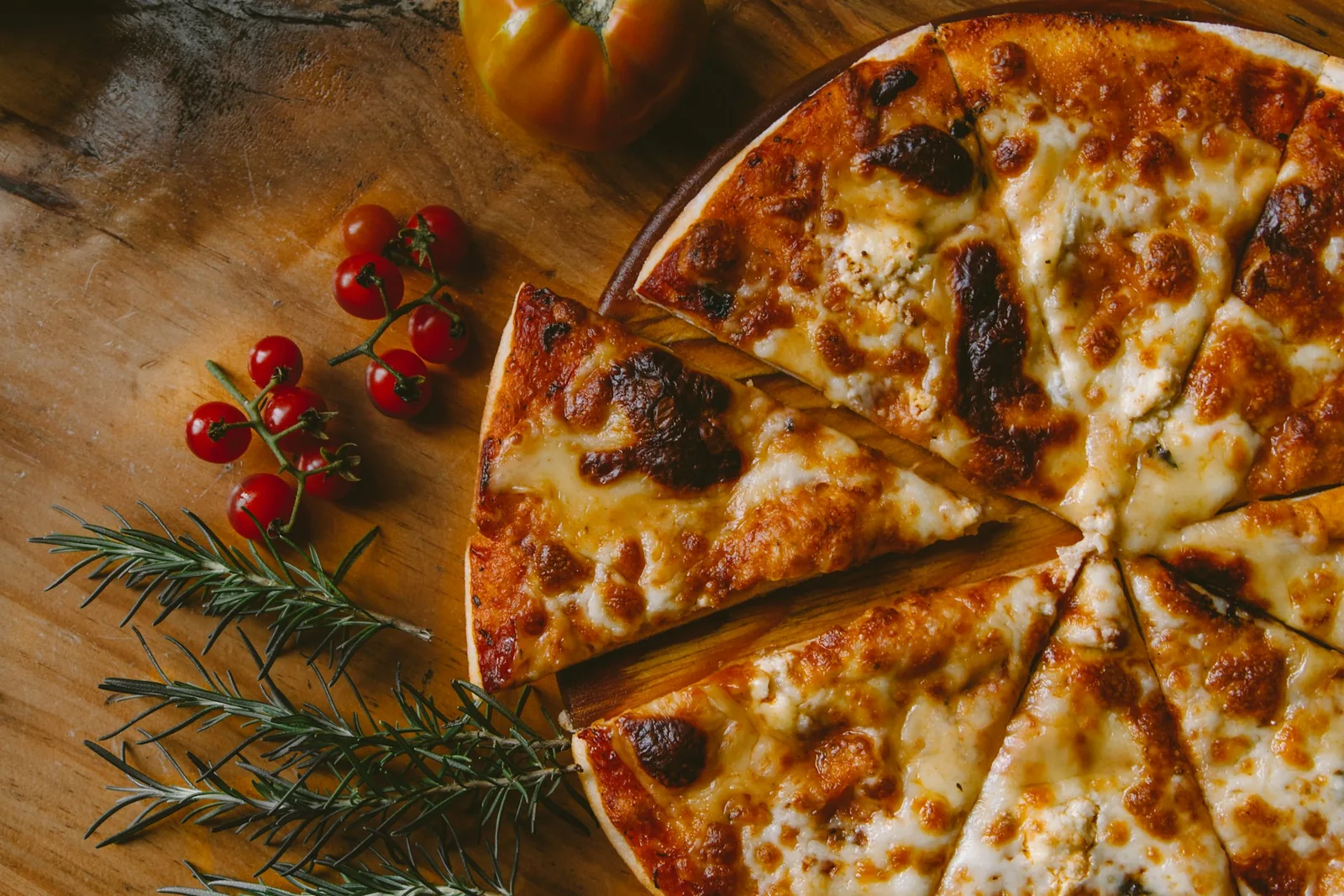 A pizza served on a wooden board
