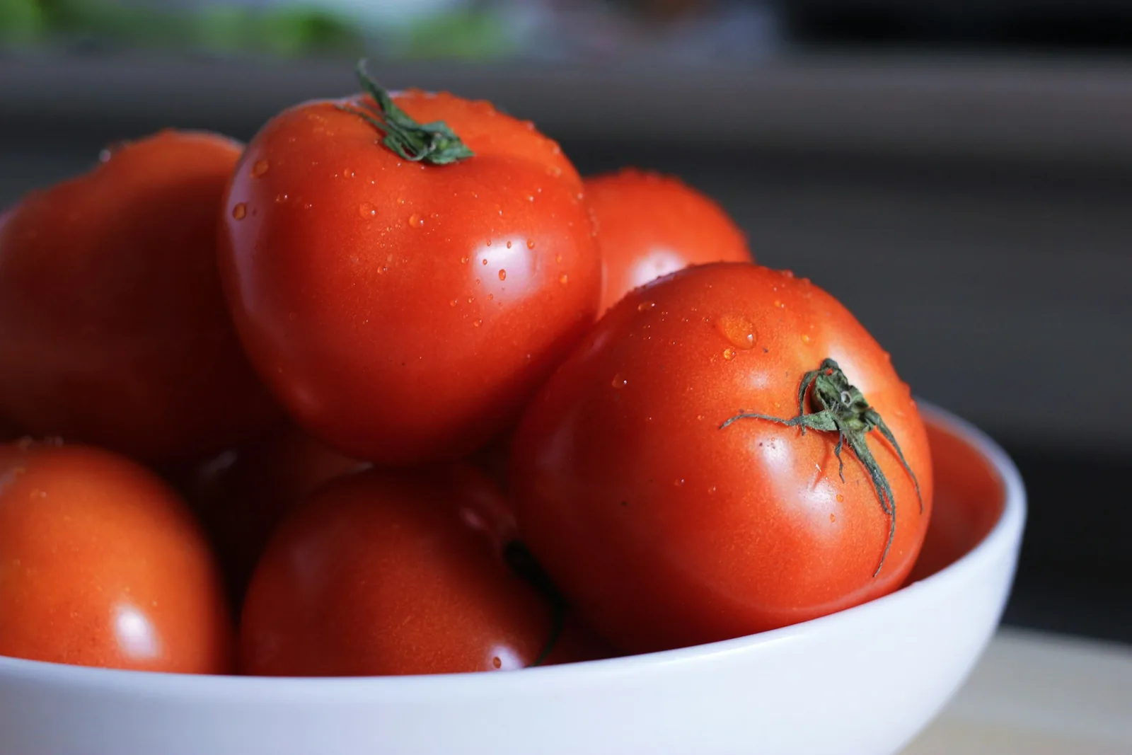 Whole ripe tomatoes in a bowl
