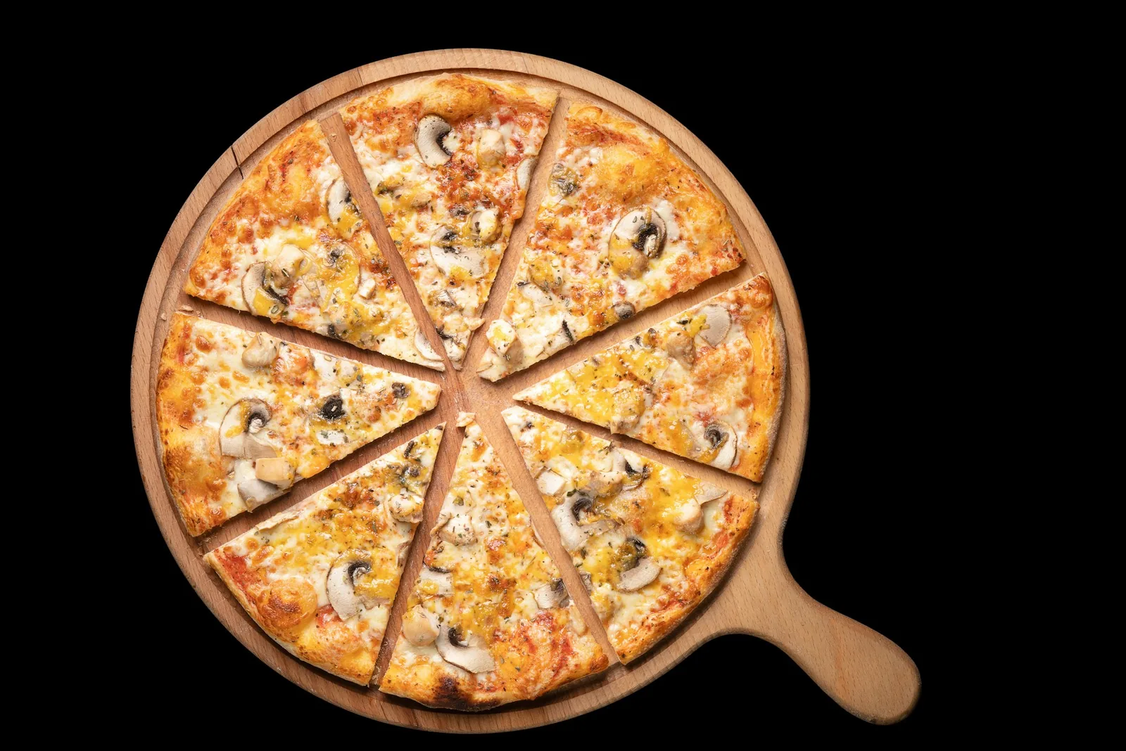 A mushroom pizza on a wooden board