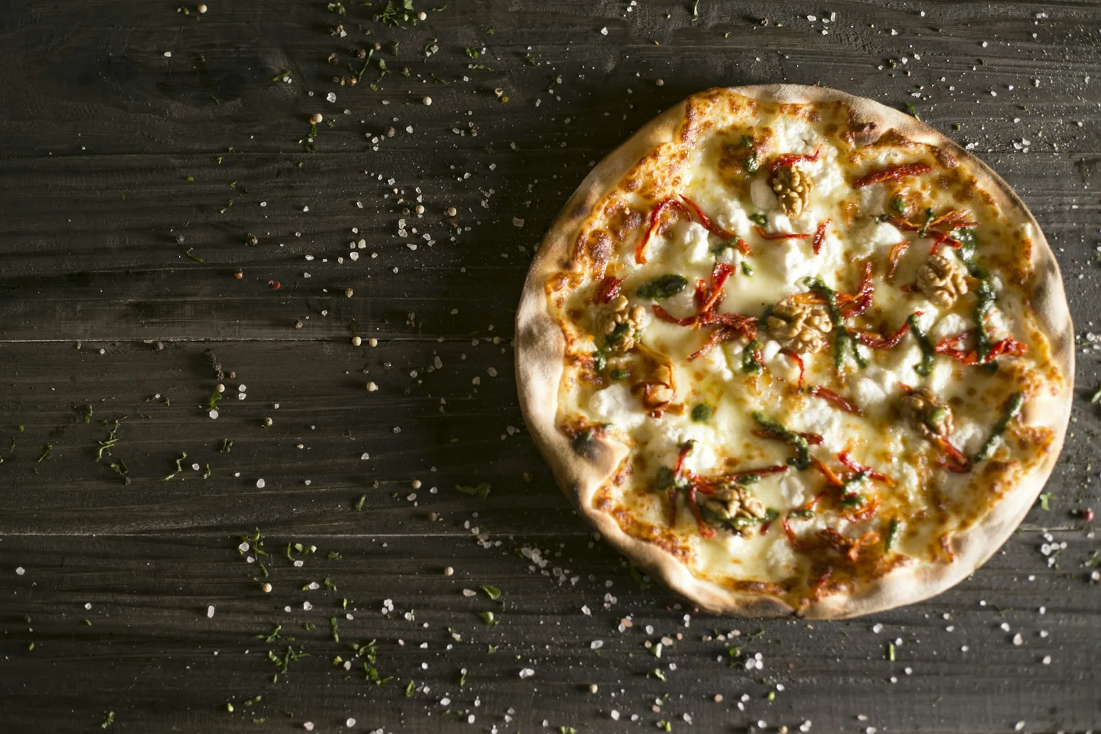Mozzarella scattered over a base