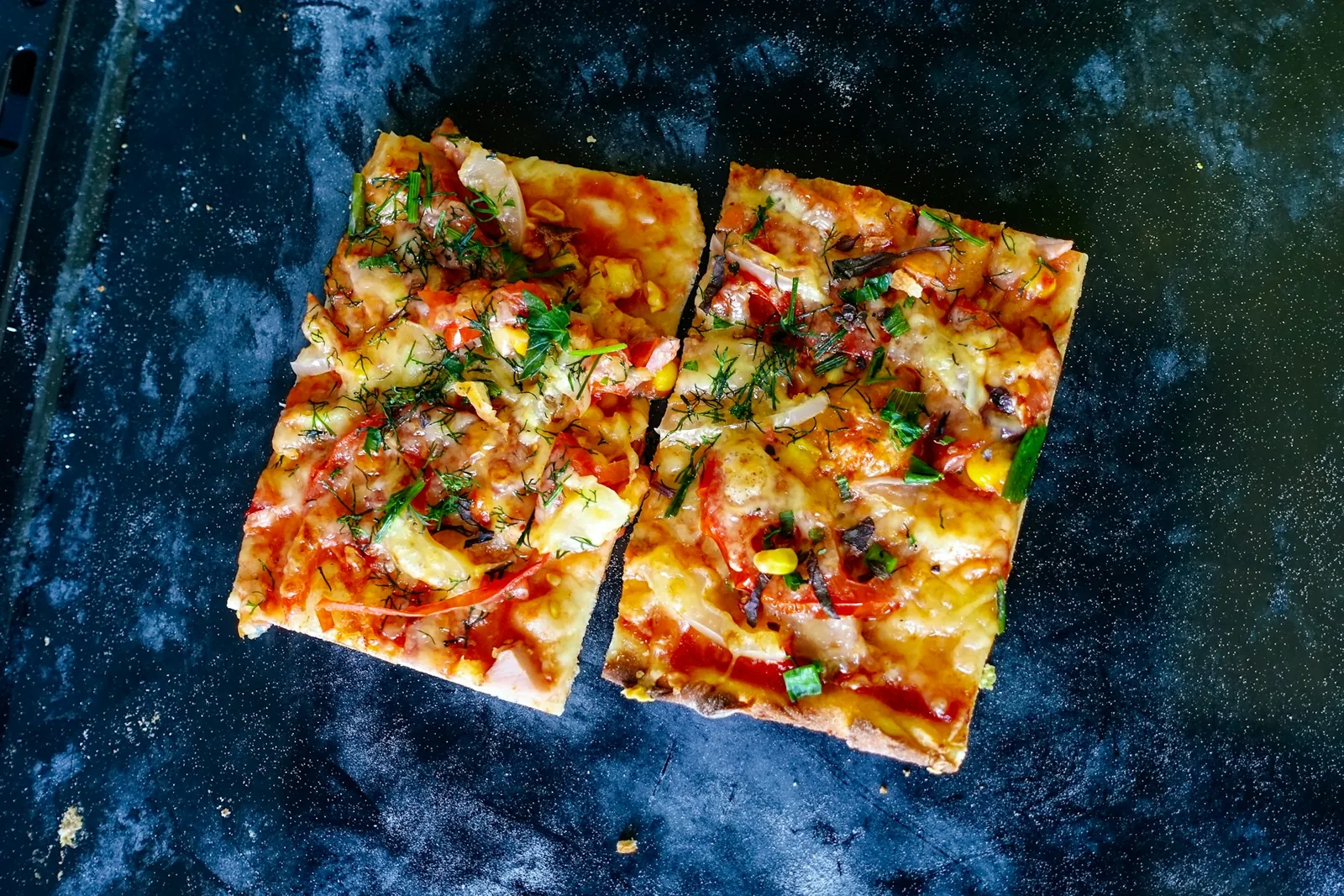 Square pizza slices on a tray