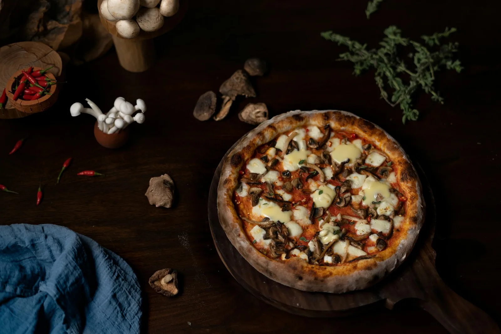 A pizza on a dark board