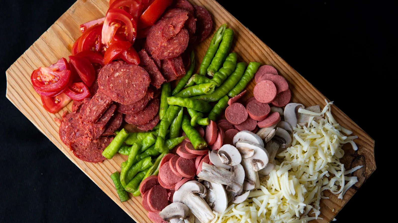 Pizza toppings prepared in bowls