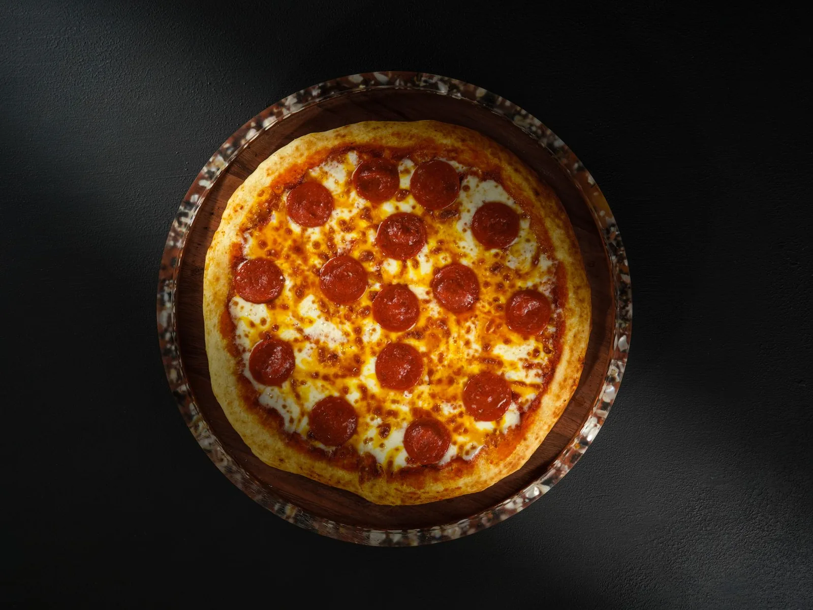A well-baked pizza with a dark crust