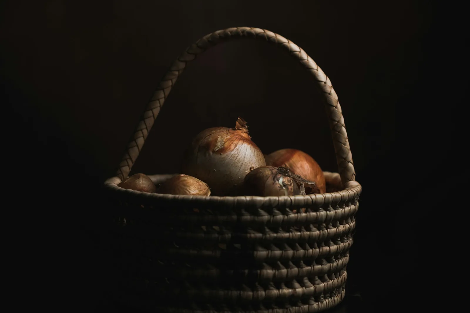 A basket of fried food on a dark background
