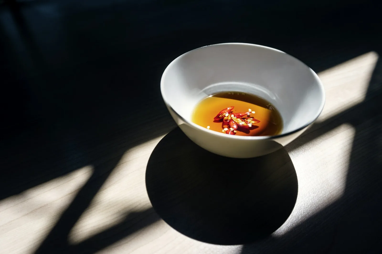 A small bowl of red dipping sauce