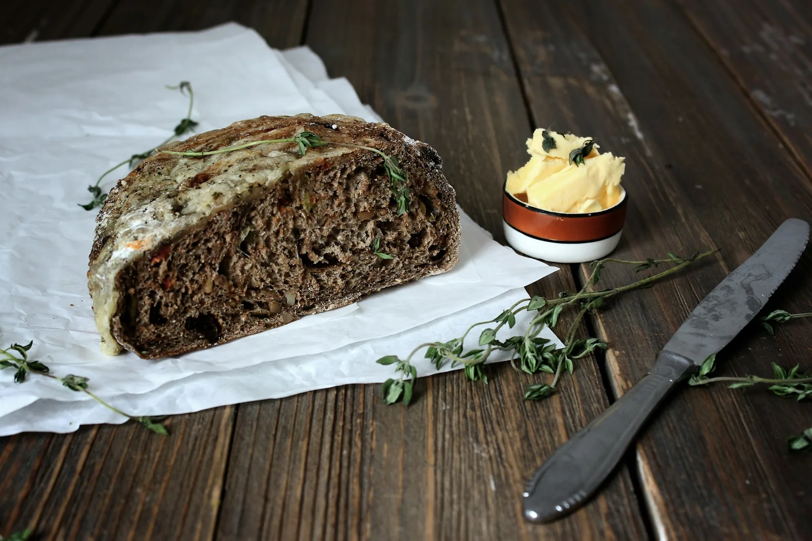 Sliced bread with butter and herbs
