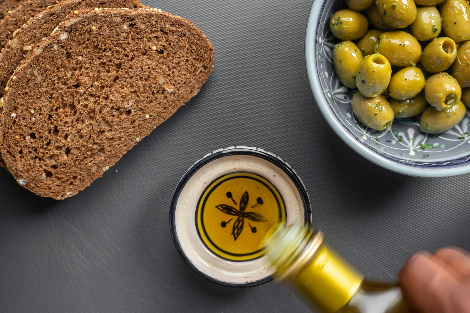 Olive oil in a bowl beside bread