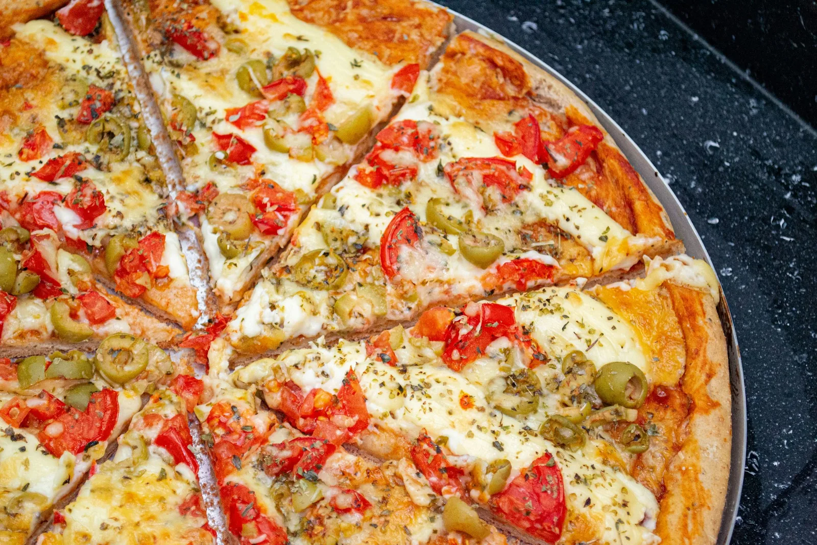 A pizza with several toppings