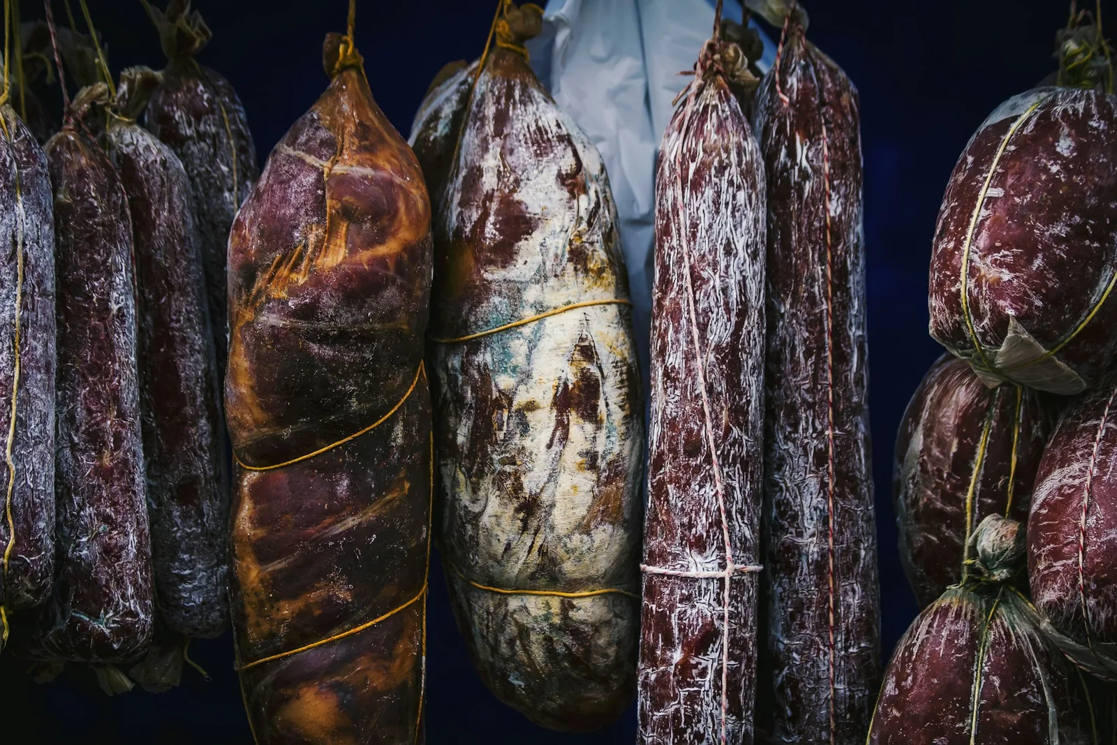 Cured meats on a dark background