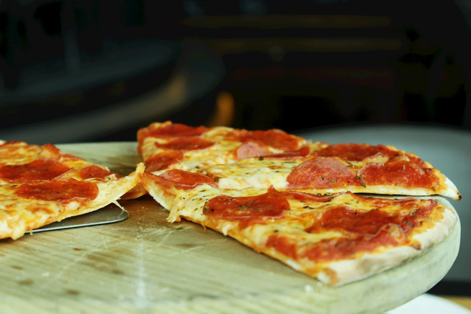A pizza slice in warm light