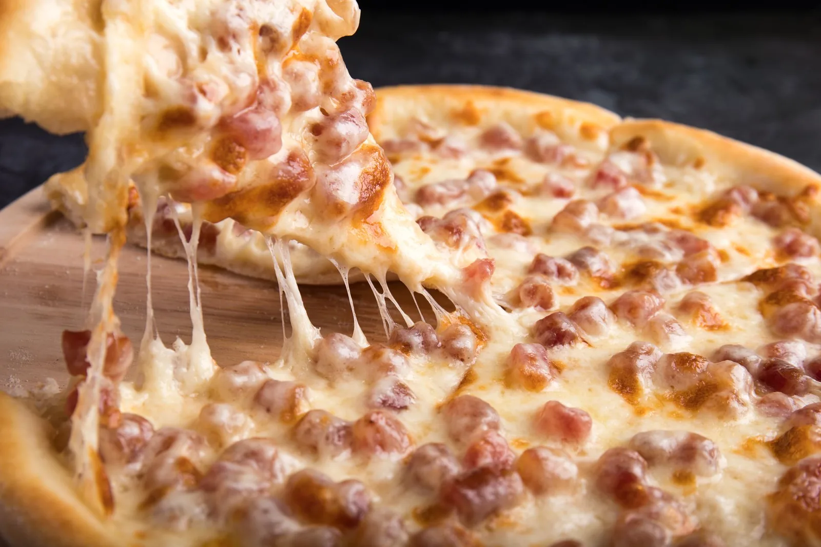The tip of a pizza slice
