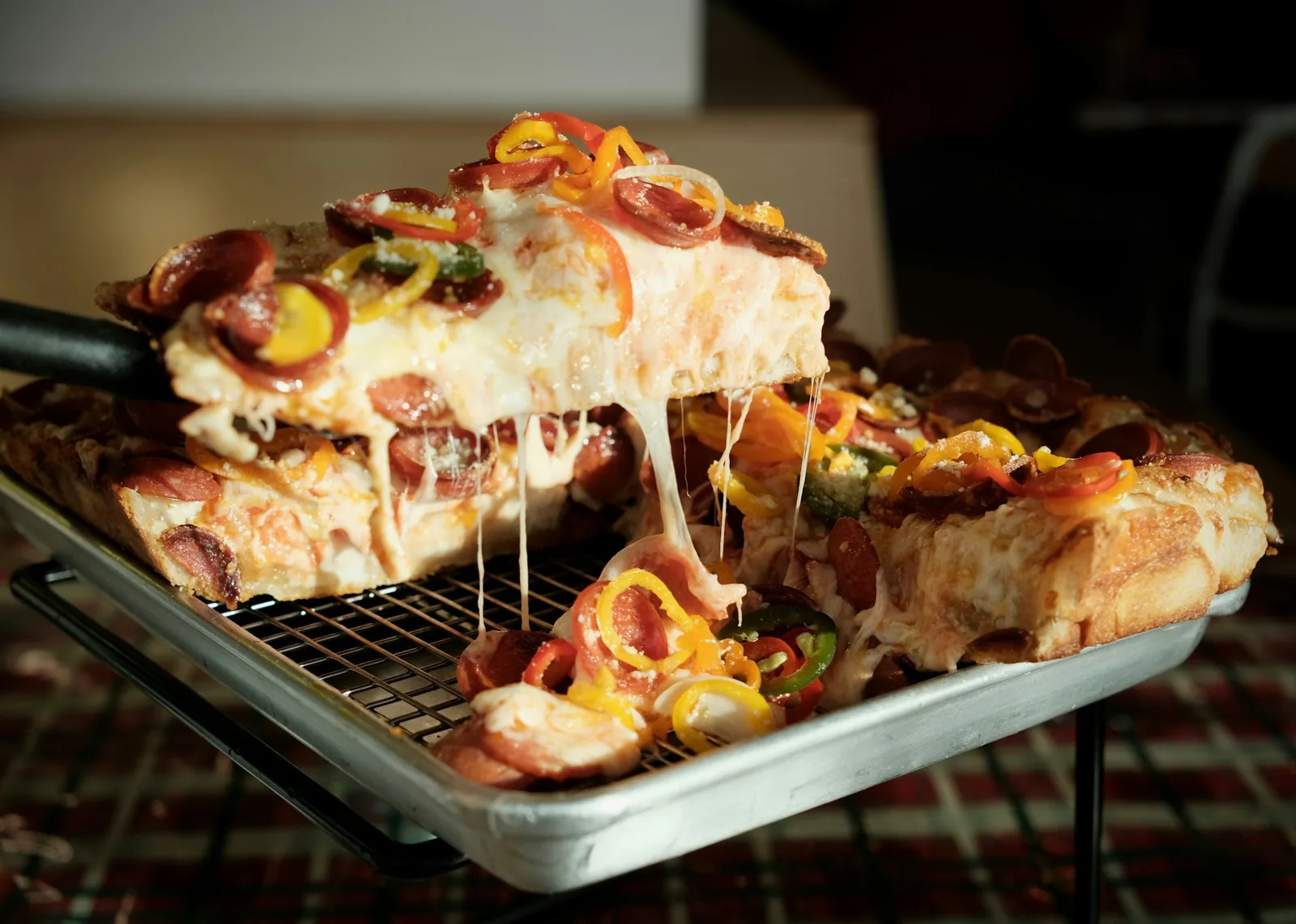 Tray-baked pizza cut into squares