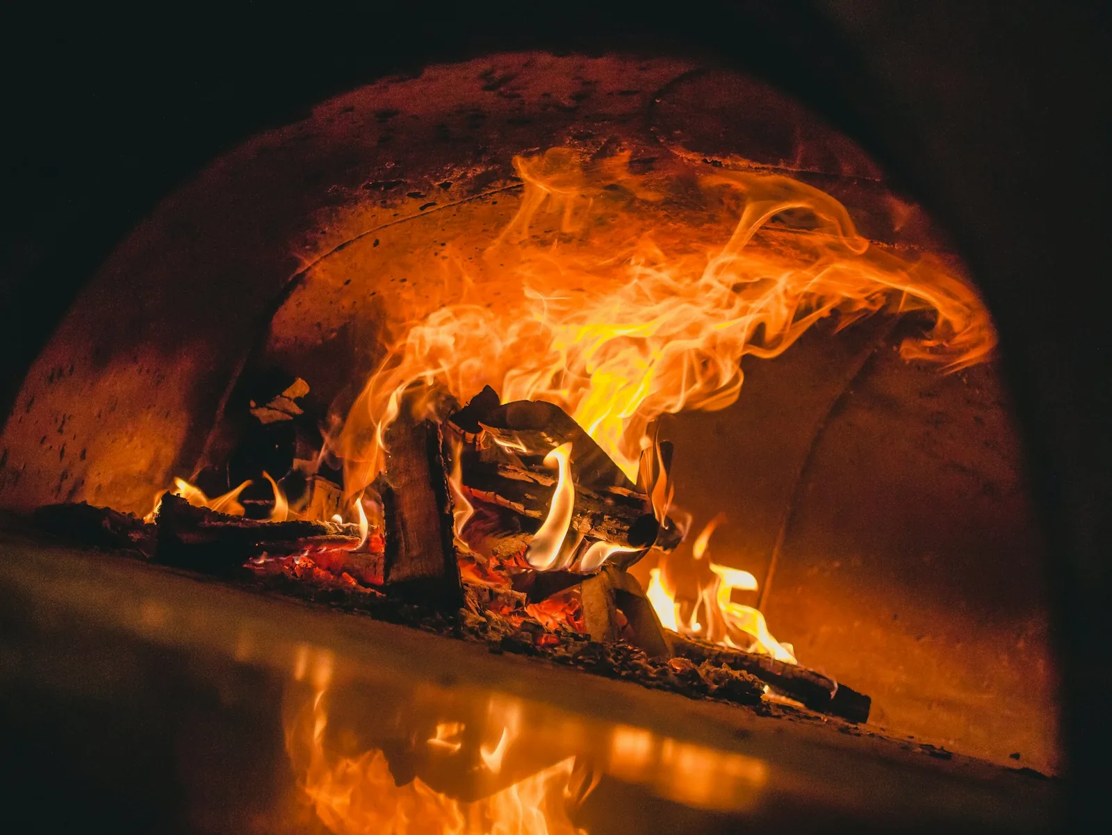 A pizza baking in the oven
