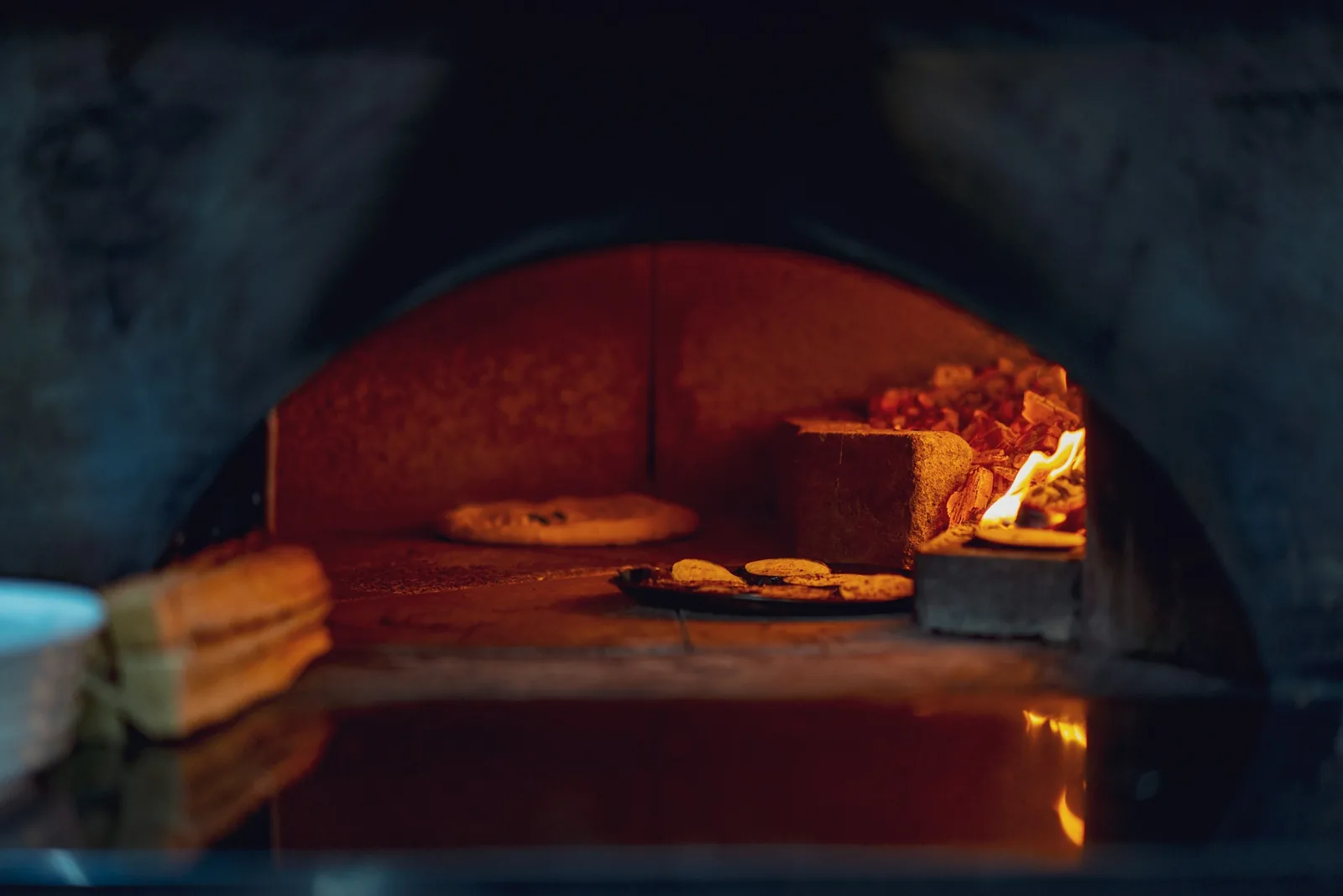 The glowing interior of a brick oven