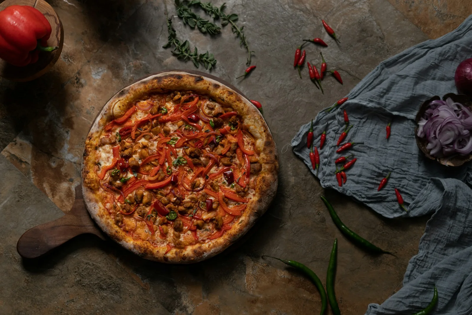 A pizza topped with peppers