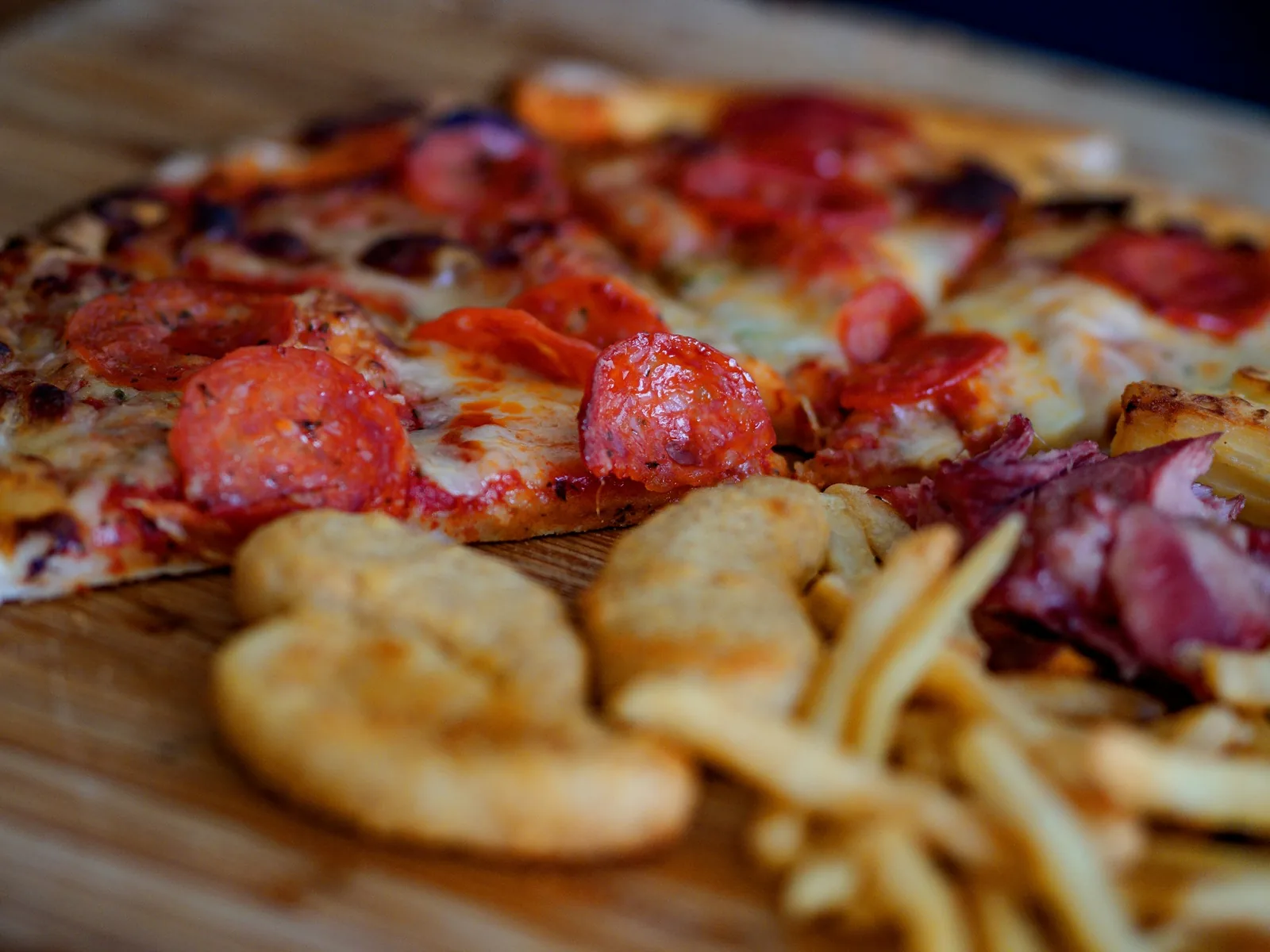 A pizza on a dark surface