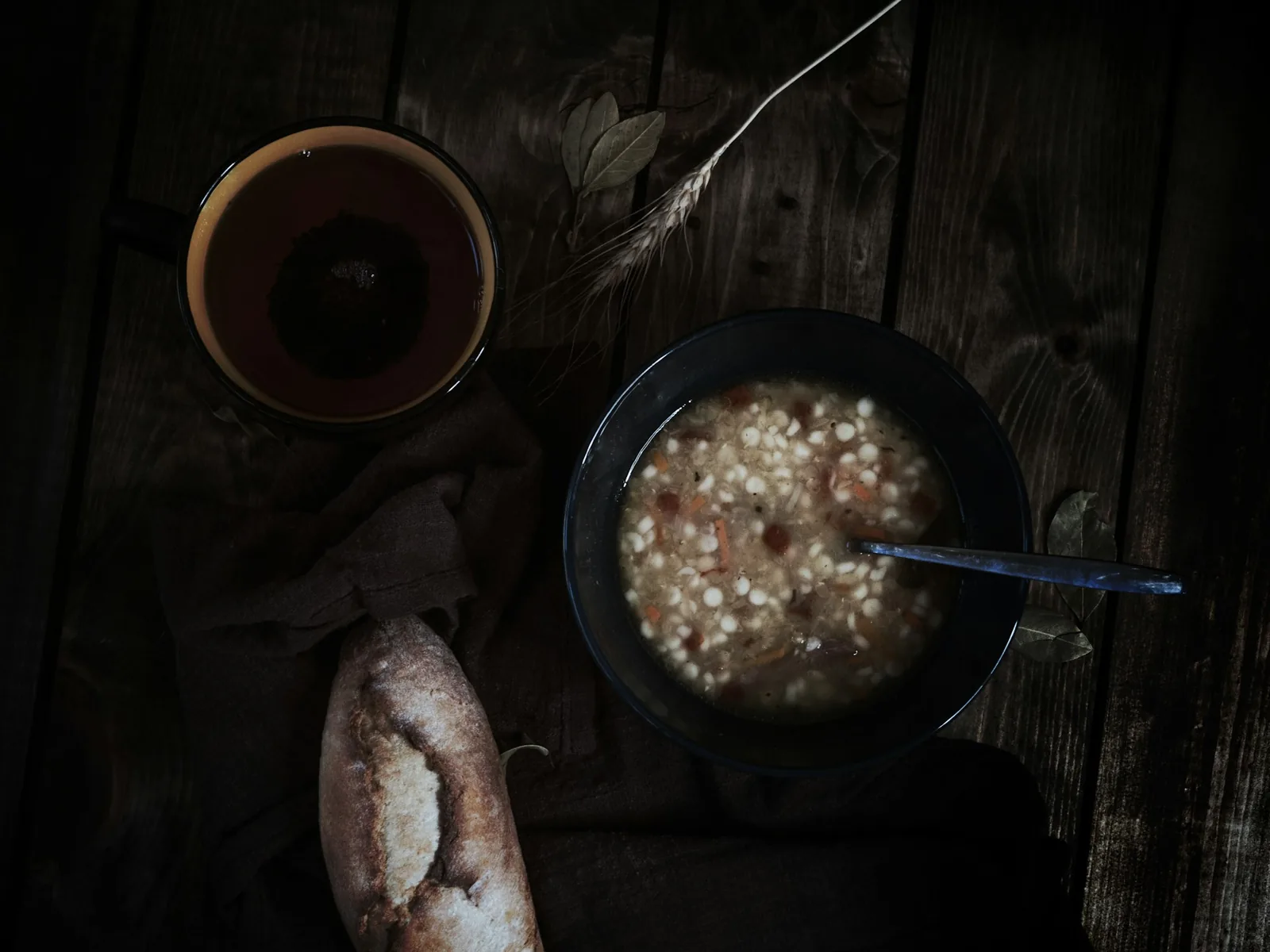 A bowl of soup on a dark background
