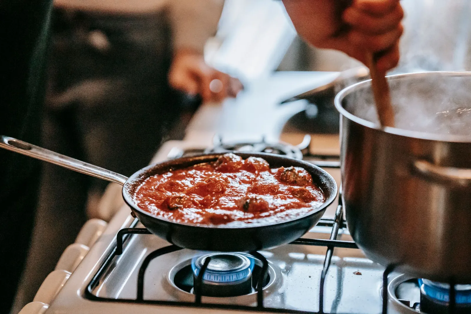 Tomato sauce simmering in a pan