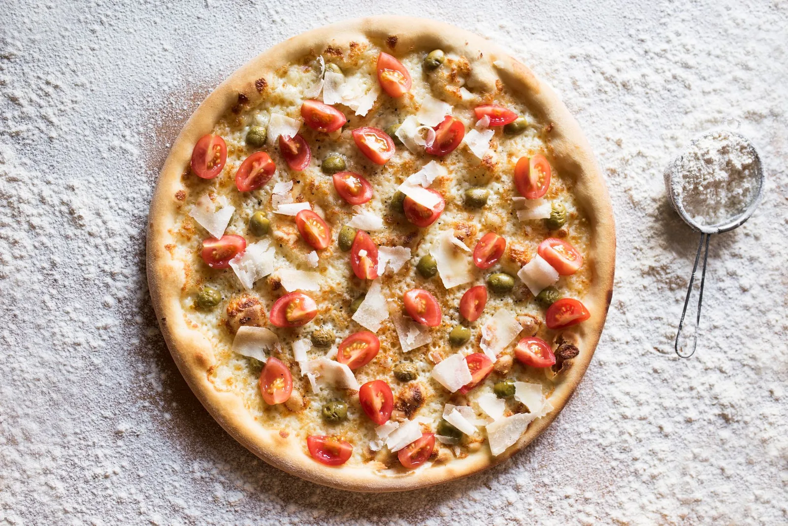 A whole cheese pizza from above