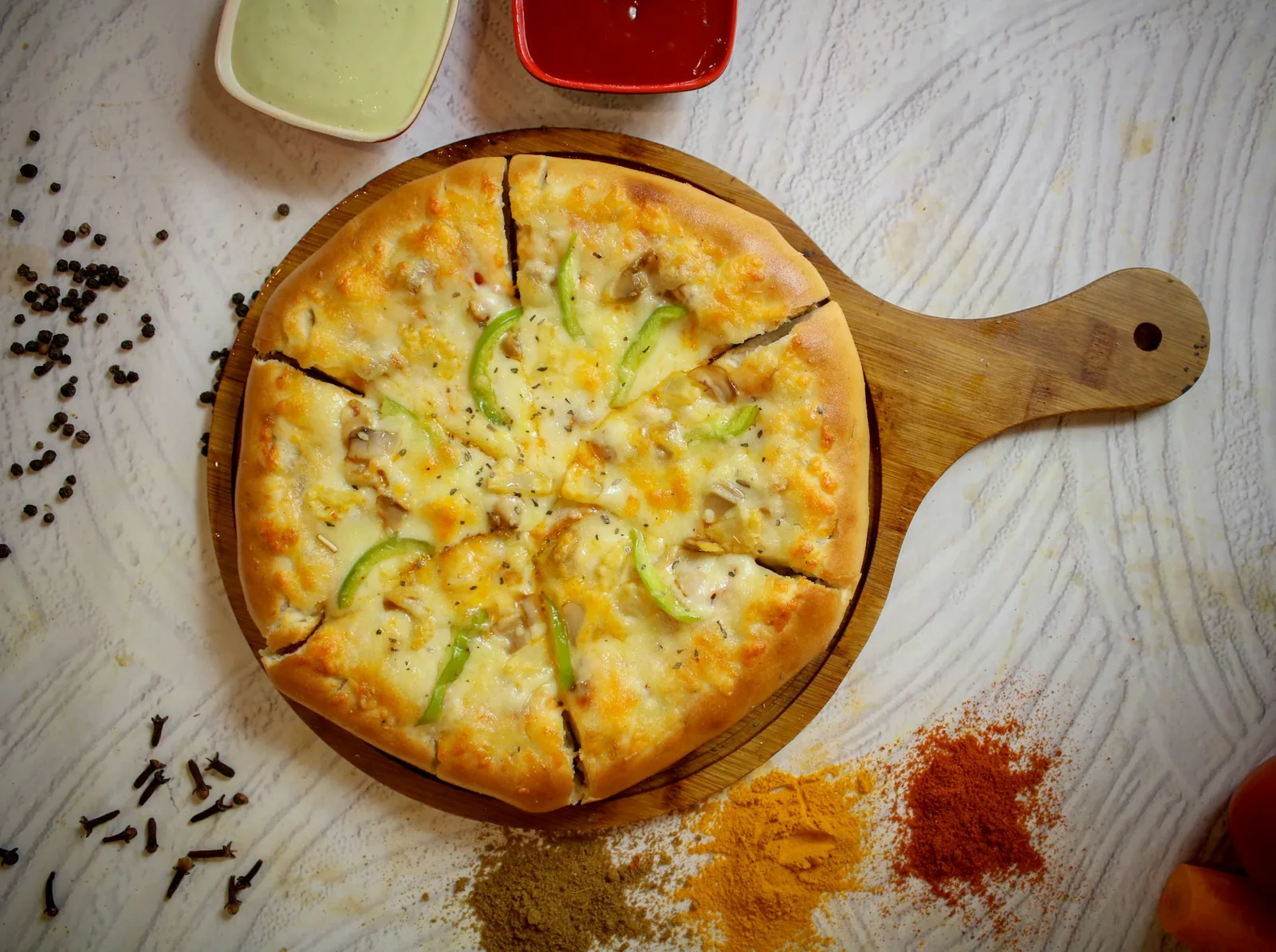 A cheese pizza on a wooden board