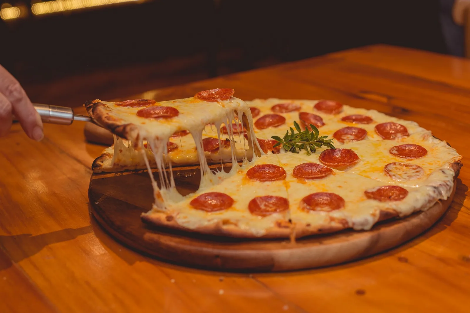 Cheese stretching from a pizza slice
