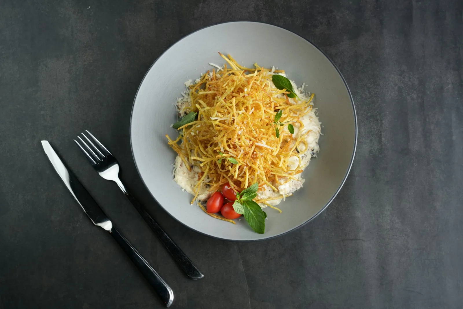 Grated mozzarella heaped in a bowl