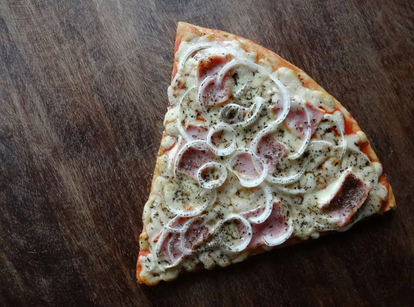 A half-eaten pizza from above