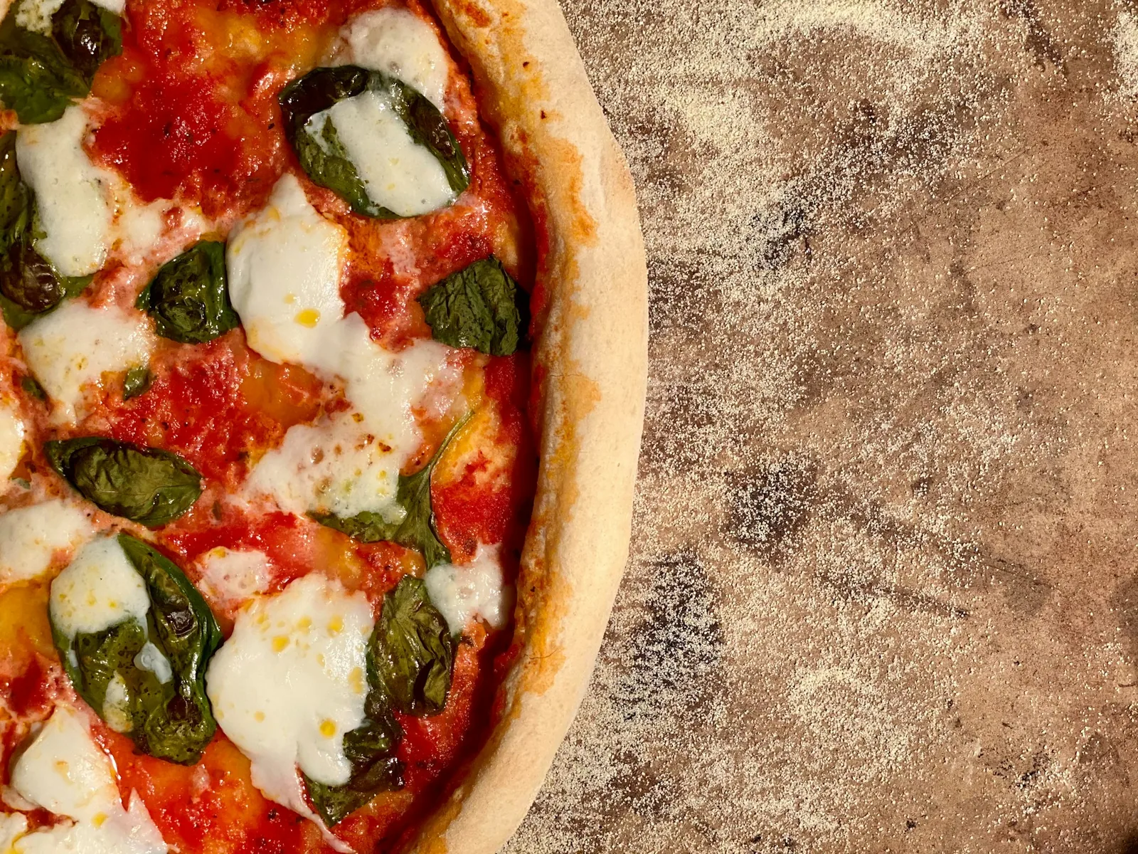 A pizza in warm light