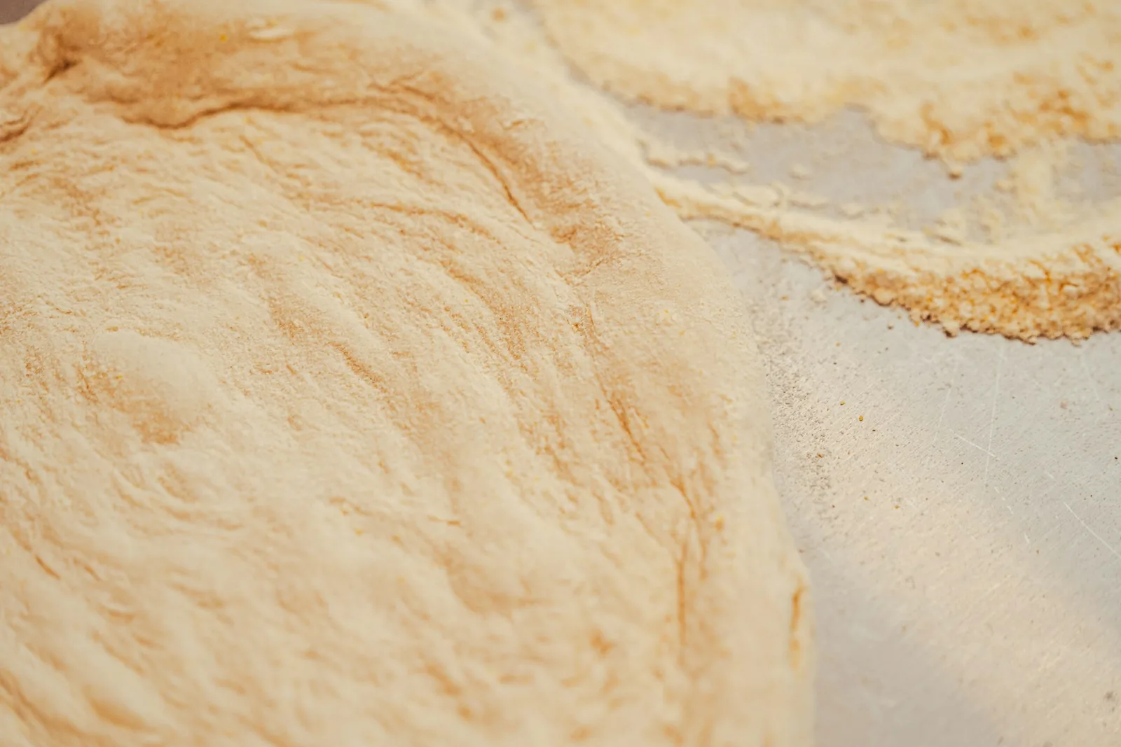 The golden edge of a pizza crust