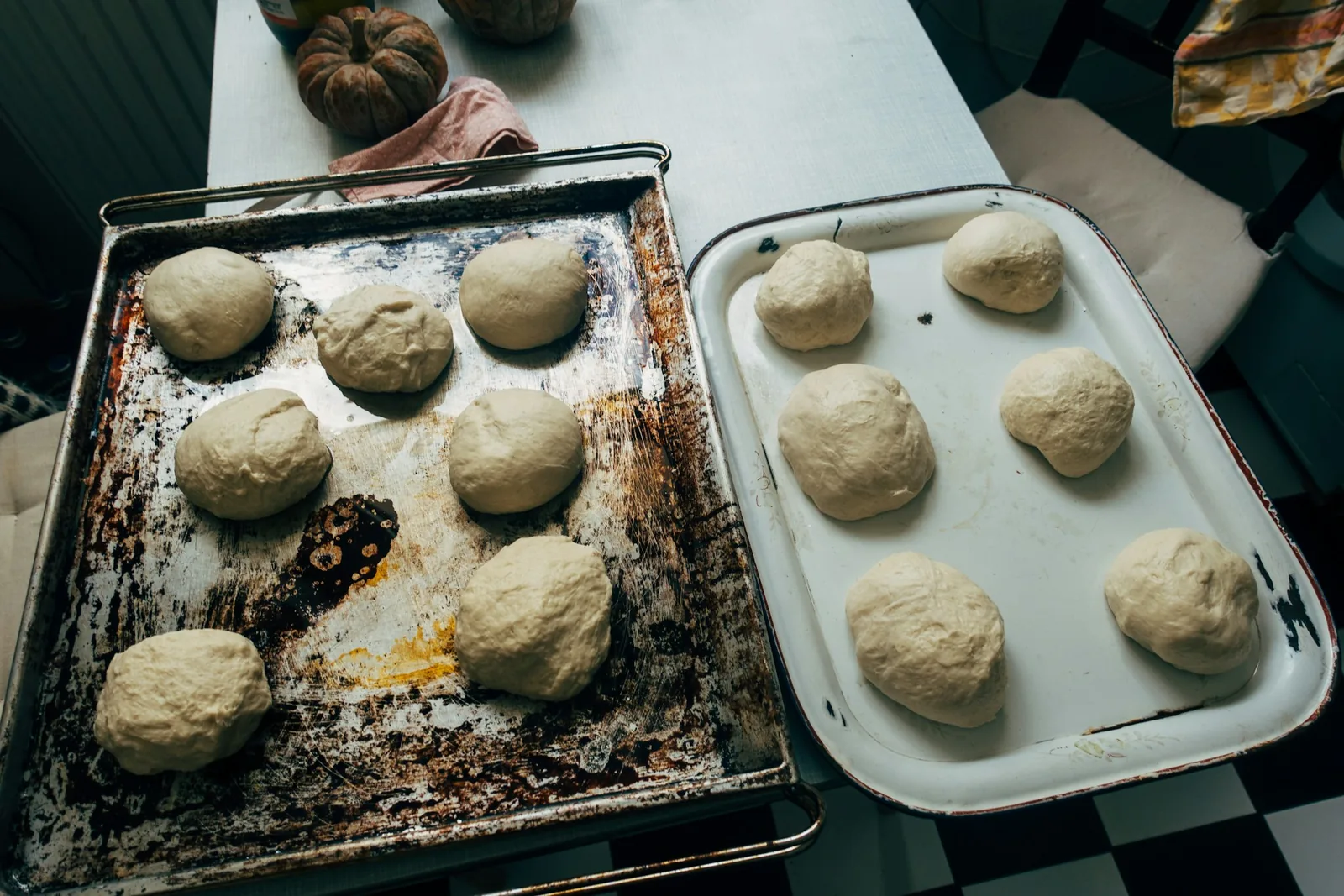 Dough balls resting on a tray