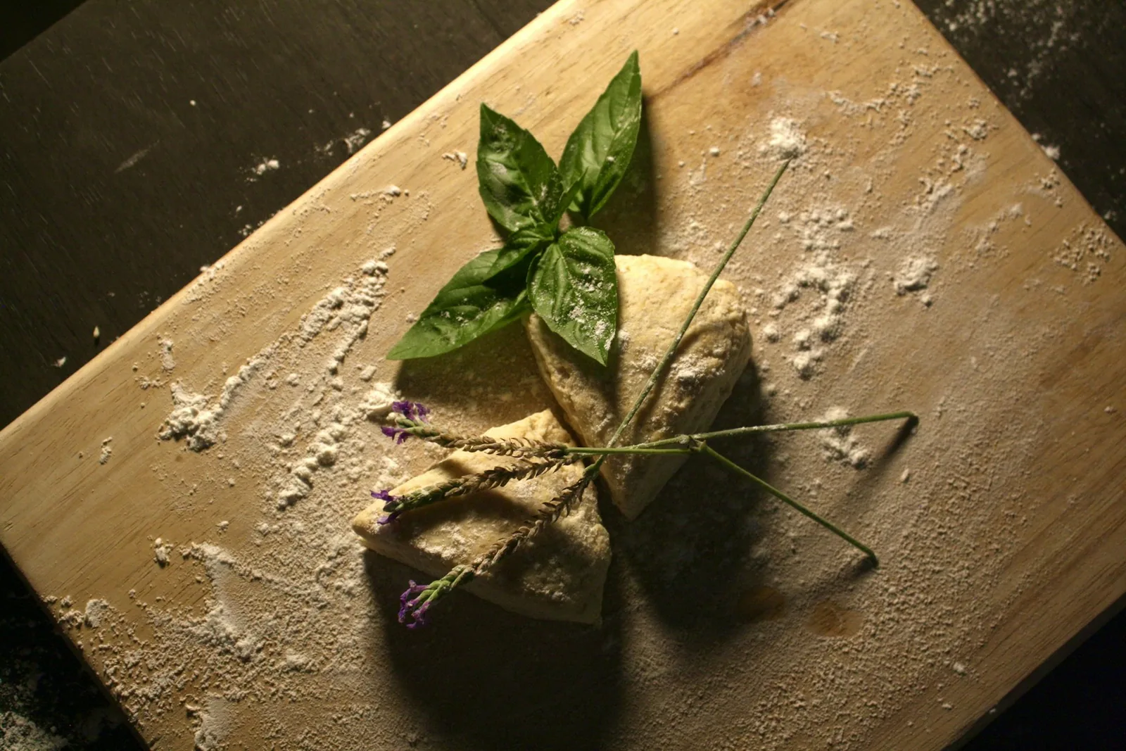 A pile of flour on a wooden board