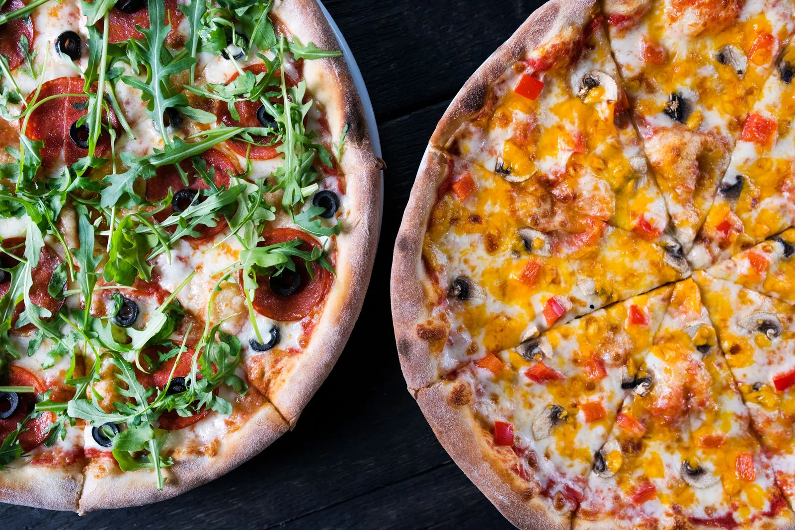 Pizza slices on a dark surface