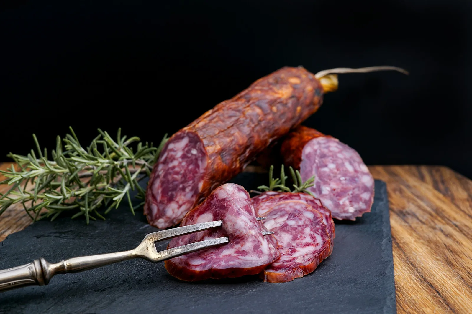 Sliced cured sausage on a board