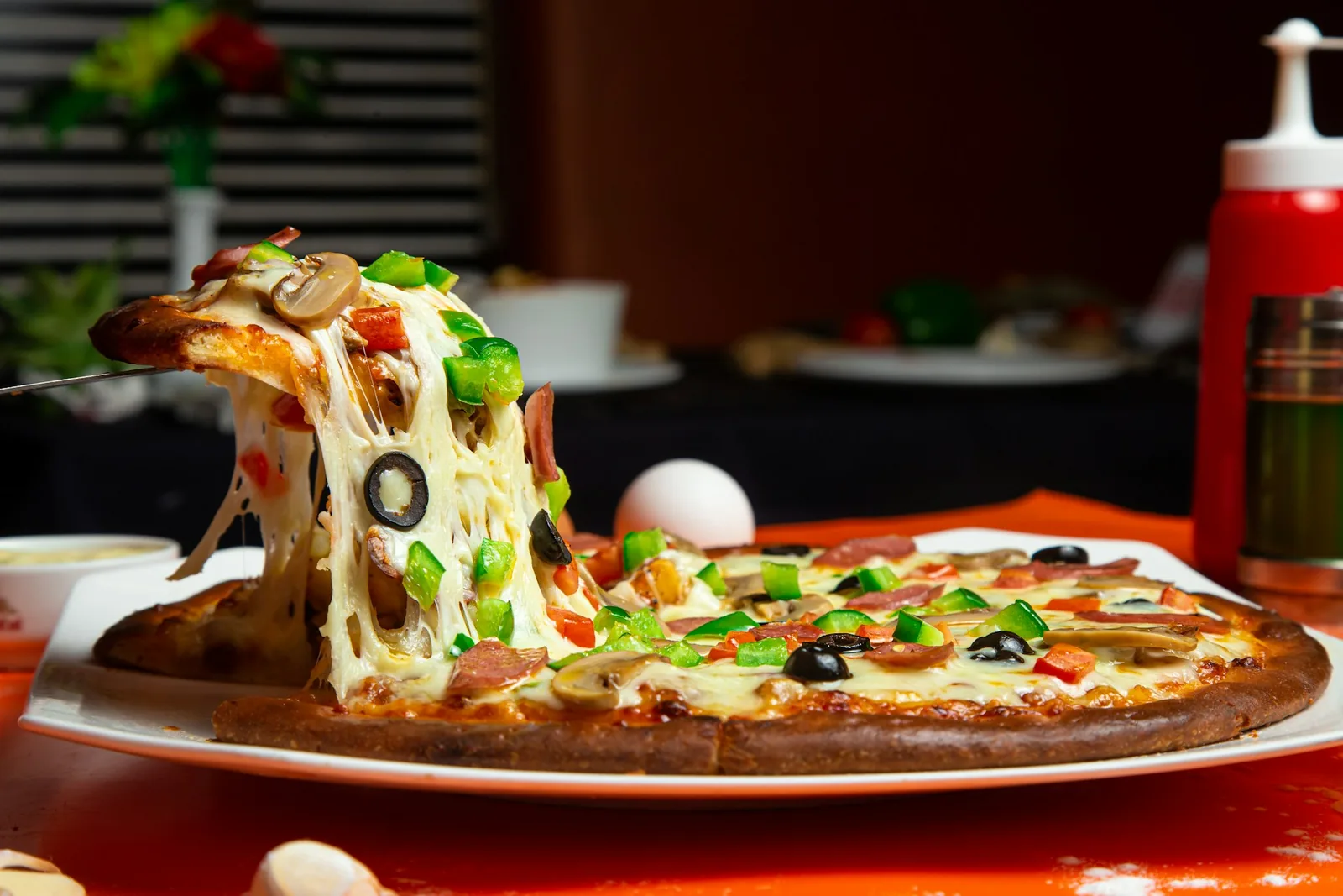 A slice lifted with cheese stretching