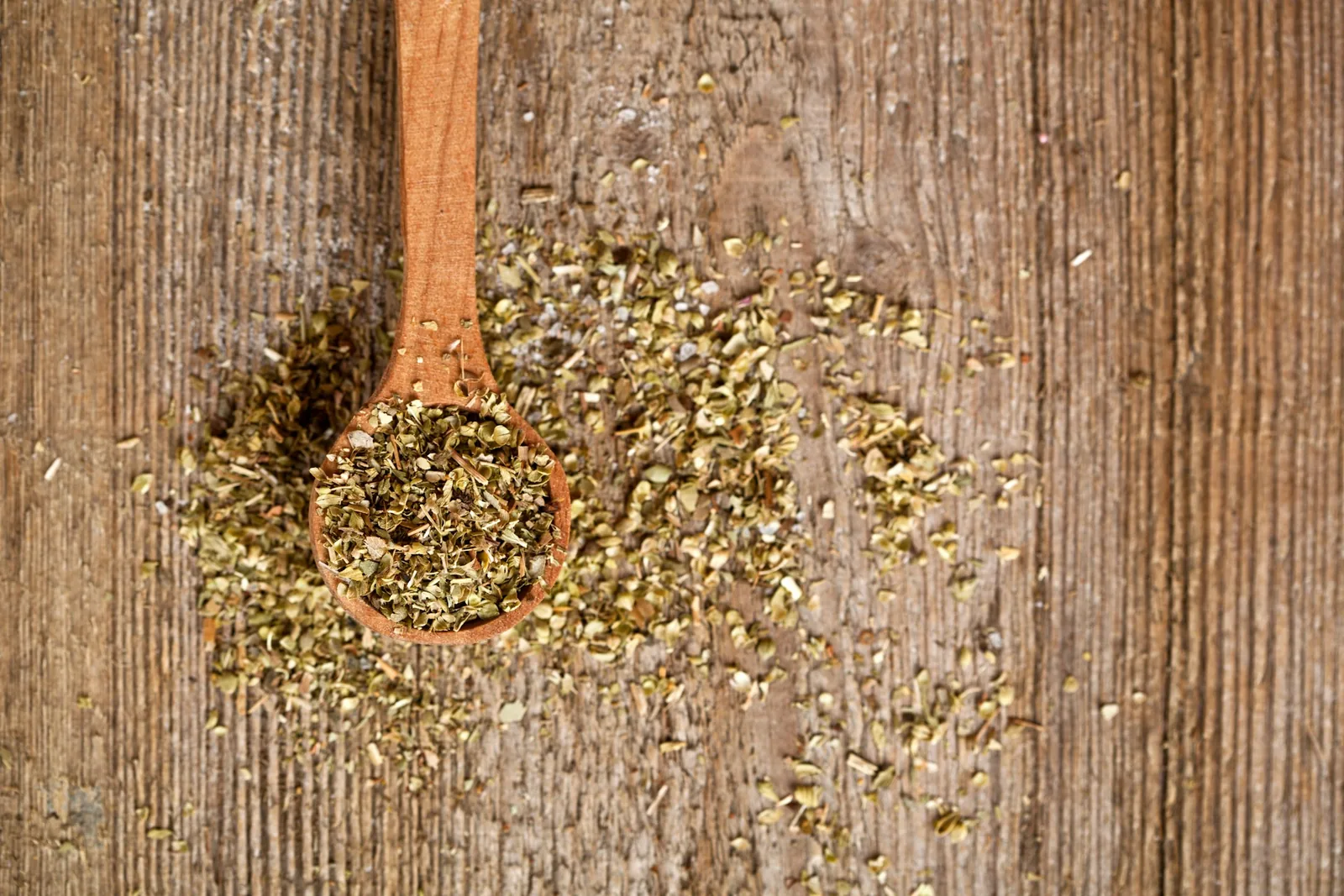 Dried oregano on a spoon