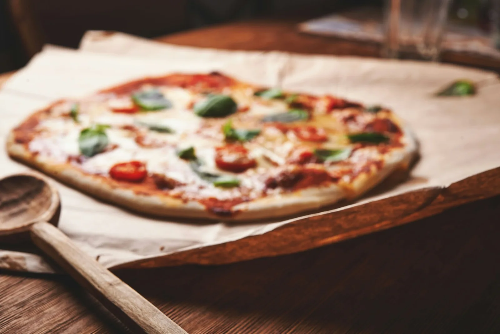 A pizza in warm light