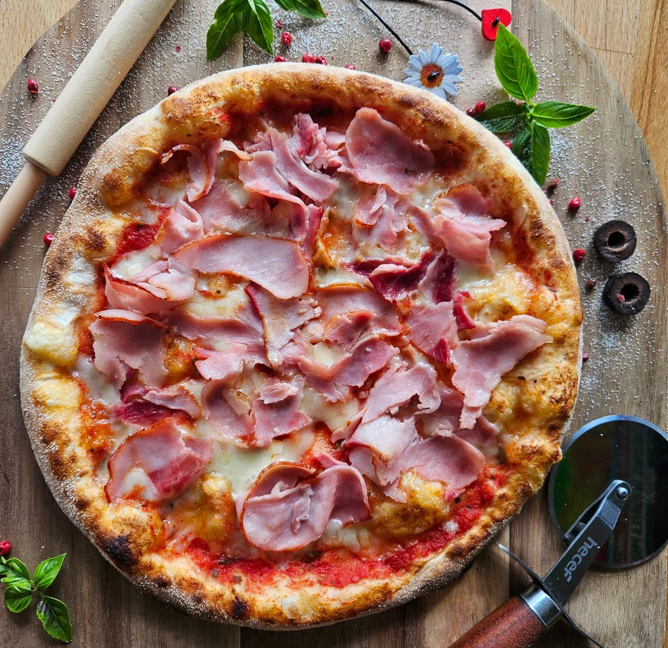 A pizza topped with ham