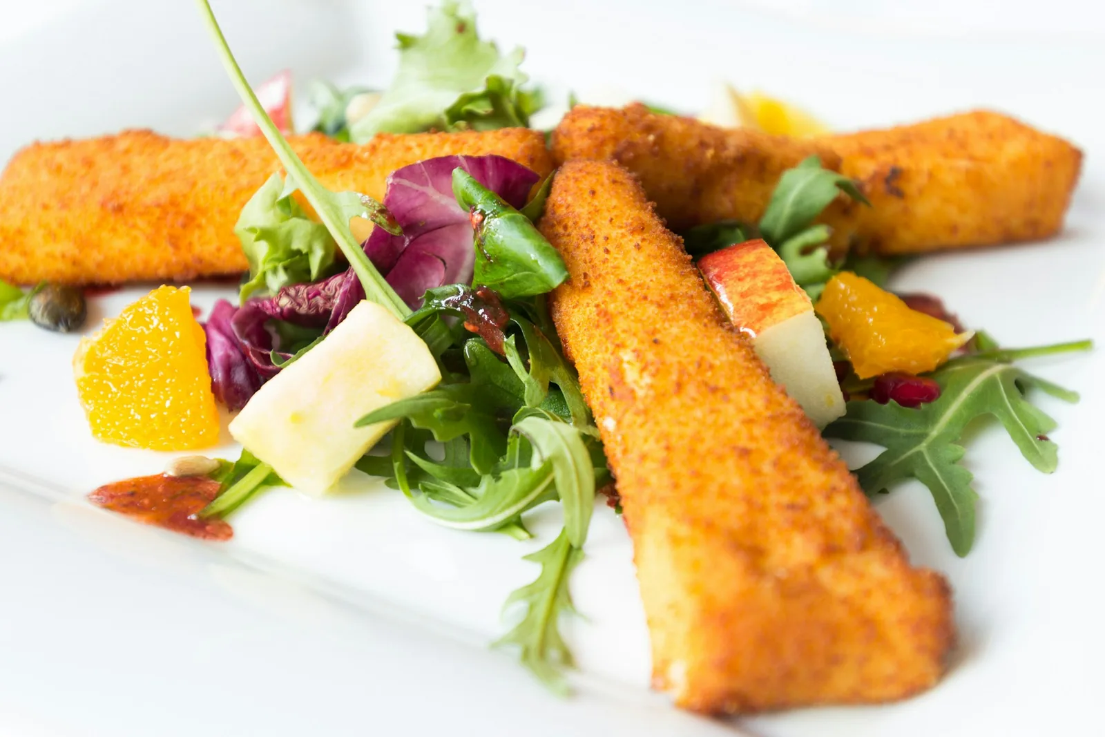 Fried cheese sticks on a plate