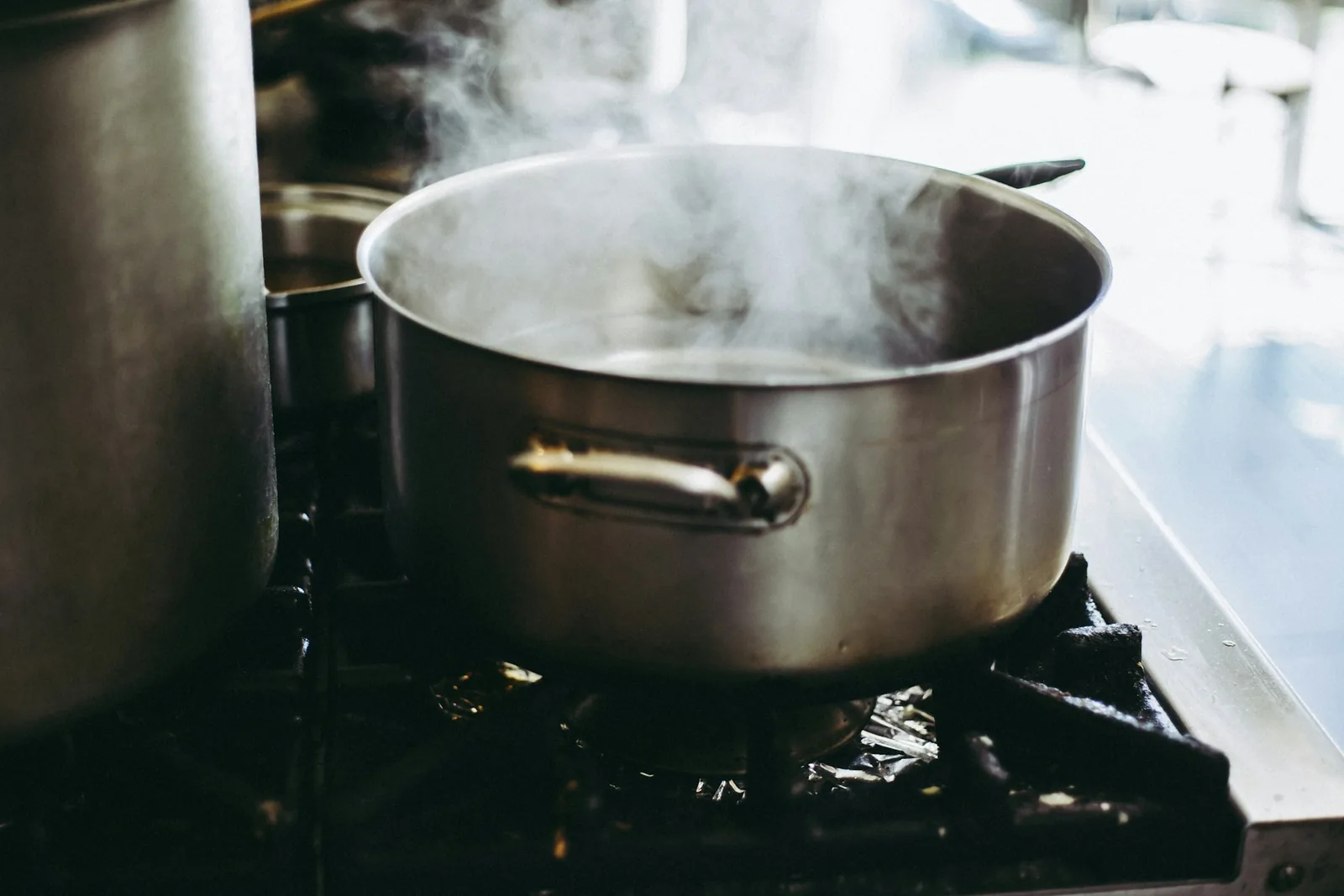 A pot steaming on the stove